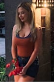 I wore this bodysuit layered with another top. The color is unique. - Rachael G.