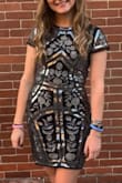 This dress fits me true to size. There was stretch to it so it was extremely comfortable to wear. It is made from a nice heavy material so it holds up. - Dana P.