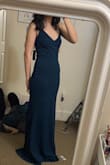 The material is thick and high quality and the color is gorgeous. Very flattering dress. The back especially is very pretty. A little bit conscious of my stomach in it but the material is forgiving. It is long so I would have to wear substantial heels with it. I also wish the front lay differently. Probably because of my own bust size but I feel like it didn't lay well on me. - Alyson L.