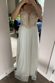 Like other reviews have already said. It looks more expensive than it is. The beadwork is lovely. And the bottom chiffon is v flattering. The only minor thing about the dress is that I'm not a huge fan of the string. I'd probably replace it with a classier ribbon of some sort. But overall, exquisite dress! Can't wait to wear it at my wedding. :) - Jason C.