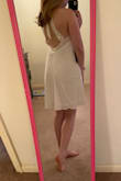 This dress is very flattering for petite gals! I'll be wearing for my engagement photos on the beach. I am having some issues finding an undergarment that would work (You can see the outline of silicon petals). - Kyra S.