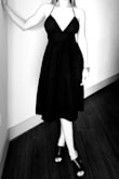 This dress is gorgeous in person. I wore it with heels for a summer dinner. The material is thick, which can get hot. I played around with the straps, only have this black and white pic on my phone, but you can have an idea. Def want to get it in different colors. - Shirley C.
