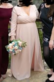 I wore this for our nontraditional, small wedding. I had to get the sleeve cuffs brought in, the bottom hemmed, and they put a hook and eye on the chest, but even so, it was truly perfect. It was so comfortable, flattering, and traveled so well. It was exactly what I was looking for. I wish I could wear it again! - Jencie R.