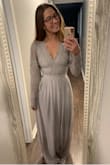 I absolutely love this dress, it's super comfortable and the lace detailing is beautiful! I'm so glad I listened to other reviewers and ordered a size down, because I am a Small 99.9% of the time, but that definitely would have been too big in this dress. The only complaints I have are: it is SUPER long so I will need to pay to get it hemmed, the sleeves are not stretchy and a little baggy AND the top lace portion and bottom polyester portion are two different shades of gray. I noticed it right away, but in pictures it is not super noticeable so I'm thinking it will be okay. I'm just not sure if this is normal for this dress or if I got a mistake since I haven't read this issue with other people? - Shaylin D.