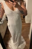 This dress is flattering and felt comfortable on (a little on the heavier side though just from the beading). I suspect this dress would look good on most bodies! The bottom of the dress has a unique geometric beading design that I loved too. However, I think it is a little too "blingy" for the look I am going for so will be returning. - Tanessa P.