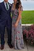 I wore this to a wedding and felt so comfortable. I did have to add a safety pin at the bust and another at the front bottom corner of the wrap dress because it dragged longer for some reason. I wore flats and didn't need to do any other alterations. As you can see in the photo, the bust area is a bit baggy, but that is the look of the dress. - Christine M.