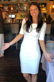 I wore this dress to my rehearsal dinner-I absolutely loved it.  Thick material so it's not see through at all.  Definitely fits like a glove, I made sure to wear Spanx underneath and a supportive strapless bra. - Nikki S.