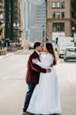 I loved everything about this dress. I looked at many 'simple' wedding dresses bc I was going to have an intimate city hall wedding and NONE compared to Lulus dress. The fabric is great and it has 3 layers so no see though undies. The arms were big on me. I did size down to a L and I still needed it tailored but overall it was great - Linda H.