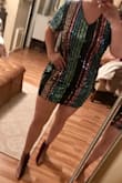 Pros: REALLY PRETTY colors, looks just like the picture!!!
Cons: This dress runs small and is a bodycon dress, not a shift dress. Also, it is short and rides up when I walk. - NATALIE C.