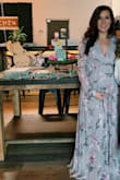 I absolutely loved this dress. I was able to wear it at 5 months pregnant. I'm normally a small and decided to order a size up to a medium. I am 5'5" so the dress was to the floor even with heels on. - Austen D.