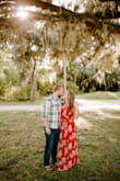Being as short as I am I had to take a good portion of the dress off to wear it with flip flops in our engagement photos. I also had my seamstress sew in a clasp so I wouldn't worry about showing too much up top but it really wasn't necessary! The dress itself was so beautiful and so perfect for the day! - Cassandra H.