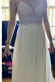 This dress is so beautiful and the quality is amazing. I bought it as a possible reception dress for my wedding and loved it so much but it didn't work out for me due to sizing. I got the smallest size available but it still didn't fit me right in the top part and I just didn't want to pay to have it altered since I already have an expensive wedding dress that requires equally pricey alterations. But if it fits, you will definitely not be disappointed! - Kimberlee R.