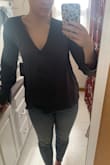 I read the reviews for this shirt before purchasing and it seems to be a very difficult fit. It has a very boxy fit and you need to be somewhat small chested in order to have the top fit. I think if I gotten a small the bottom would have fit but my boobs would have been squished. Otherwise, the fabric is amazing and very good quality and it breaks my heart to return it. - Paige O.