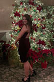 Bought it for a work Christmas Party! It fit perfect! I bought a Small. It's very form fitting, Accentuated waist line. Highly recommend. It's a subtle sexy dress. It's knee length but the back is eye catching! - Michelle J.
