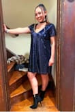 I bought this for NYE and I got so many compliments on it! The sparkles WILL get everywhere, but if you don't mind that it's the perfect cut and length. I did size up from my normal size and I think a small would've been more form fitting, but overall I'm really happy with the medium. :) - Jen M.