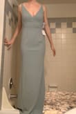 This was a very flattering color but I felt the stomach area would need to be taken in. The black version of this dress was amazing and didn't show the increased fabric in the stomach area. I do have an athletic build though so it might have fit other body types better. - Christa S.