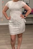 I ordered a rose gold in a L and it was the perfect fit just not color. So I ordered the white in L and it was significantly smaller than the other dress! I didn't want to exchange it again so I kept it anyways. However, it was very uncomfortable. Beautiful and sturdy dress though! - Emily O.