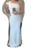 I love the unique one shoulder strap, and it has a sticky lining on the side without the strap to help keep the dress in place. The material is light and comfortable to move around in. I'm keeping it as a contender for my reception dress, though I will try it again with some spanx for more tummy control. I ordered the small, I'm a 36B and it fit tight around the bust but I like the tighter fit. - Tanessa P.