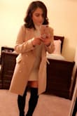 I bought both the tan and black coats. I absolutely love the tan more than I like the black one. Even though they are both Smalls the black coat is slightly big. I have to fold the sleeves. As to the tan one it fits perfectly. I wear the tan a lot more because it just fits better and because of the sleeve issue. But I still really like the black one. I definitely recommend the tan. - Viviana G.