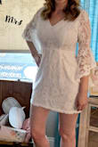 I tried this on and thought it was just ok but then I wore it backwards and loved it! The v neck of the back looked better on me in the front and nobody could tell it was backwards. So cute! Was perfect for my bridal shower. It fit me true to size so dont size up or down. - Sarah F.