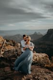 This dress turned out AMAZING in our engagement photos. I suggest ordering a size down. Because it's a wrap dress it's easily adjustable. But I had mine wrapped super tight and it still felt a little loose in the bust. It was a little long also. For the photos it was perfect but if I was wearing it out I would have gotten it hemmed. - Alisse L.