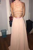 This dress fit me perfectly. At first I was worried that it would not fit and I would need to get it altered, but the only thing i need to do is get it hemmed! I ordered an XS and I am very petite and was so excited that it fit me. The material is amazing and the color is exactly what I wanted. 10/10 recommend!! - Stephanie C.