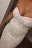 The dress is so beautiful in person, but the bust is way too tight if you are more than an A cup. - Shakira H.