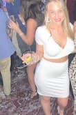 Bought this for my bachelorette party in the Bahamas. I ordered a medium for my bigger chest, it fit but the only problem was if I lifted my arms I had under boob coming out through the wrap. It's not sewn closed. It's not see-through which is awesome, it did accentuate the belly a little but probably because of the high waist. All in all, I loved it and would definitely recommend. - Michelle A.