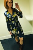 I have zero complaints about this dress. I ordered a medium since I am large chested. A medium has just the right amount of room in the shoulders and back so that there's none of that dreaded tugging. I was also concerned about the front coming open and showing my bra (which would make it a no-no for the office) but that hasn't been a problem at all. Unlike many wrap dresses, this one stays shut in the front!  Yay! - Charlotte S.