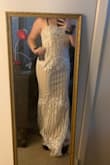 I will wear this as my wedding dress. I think the material is perfect, it seems so much more expensive than it really is! It does run small, I would normally wear a medium in Lulus or any other brand, but I chose to size up since it was final sale. It does fit me, but I will have it taken in, in a couple of places, since I want it to be perfect for my wedding day. (strap in the first picture is my bra strap) - Kayla W.