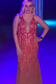 I purchased this (and the black one just like it) to wear to Mardi Gras Balls this year. I wore the red one to the first ball, and got sooo many compliments. It's high quality, worth much more than I paid for it. The mesh area on the chest is nude and blended just fine with my skin tone, as you can see from the photos. The cut wasn't too low either, which I was nervous about. It looked fantastic and I can't wait for a reason to wear it again. The fit is true to size. I did have to alter the length because it was too long for me, as most dresses are, because i am 5'4 and I don't wear heels. If I did, it would have been fine. I absolutely recommend it! - Niki A.