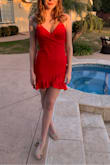 This dress for my daughter perfectly!  It was beautiful for her winter formal.  Form fitting but not tight and short but not too short. - Devon M.