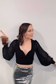 Firstly, the material is so comfortable.  Secondly, the flowy arms and open back are so fun.  Thirdly, the framed plunge front is genius.  I personally wore it for NYE, but I cannot wait to wearing it a bit more dressed down for other nights out. - Jennifer F.
