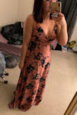 Love the dress. It's very trendy and unique. The top runs a smidgen small, but I can still wear it! Bought it to wear to my friends bridal shower. - Meagan H.