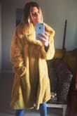 I love this coat so much. It is so soft and such a fun color. I would highly recommend. The quality is wonderful.  I would stick with your normal size. It fits slightly large but I prefer that for coats anyway. - Jacqueline M.