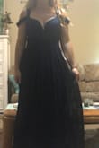 The dress fits nicely. The dress is great quality. I love the top of the dress. The sleeves are a bit odd but when you pull up the bottom sleeves to make one i think it looks nicer.  The bottom is a bit flowier than I like it but I am wearing this as a bridesmaid dress so what ever makes the bride happy. Great dress and site would highly recommend. - Sydney N.