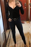 I'm always a size small at Lulus but this did not fit me well and I had to return. It was tight around my body and my arms, and it was much lower cut then I anticipated and I would not have been able to wear any form of bra. The material also has no stretch to it so overall it wasn't very comfortable either. It has 2 snaps to close at the crotch but it felt kind of bulky in the area. - Emily S.