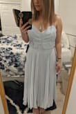 The material is decent and as expected, but the sewing was subpar and very uneven. Also, the top runs a little large and made me look a bit boxy. - Lisa D.