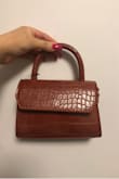love the style and size of the bag - so cute and chic. however there are a couple noticeable scratches on the back and the flap is crooked when closed. i will be returning it. - Kristen M.