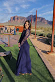 I got this dress for a chilly January wedding and it was great! The sleeves are pretty loose which is the only thing I wish was different. The pattern can make you look chunky by making the arms look wider. The length keeps you warm even when the back is exposed. With heels it was the perfect length but if you're short it needs trimming. - Rebecca C.
