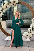 This dress is the perfect wrap dress! It is so flattering, the top is covering. There is a lot of fabric with the dress, so it was perfect for the Florida winter wedding I attended. It moves perfectly when you walk. I wore 2 inch heels and it didnt drag. Honestly i am just trying to find another time to wear it! - Cassidy C.