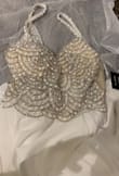 This dress is so pretty and simple, I ordered a size 6 I find it a tad bit tight on my rib cage and the straps a little loose (I think because I'm short) so I will just get the straps taken up a bit. It's beautiful and so worth It! - Beth R.