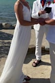 I wanted a "simple" dress for my backyard beach wedding, and this dress was perfect! I couldn't believe how high quality the dress and it's material for the price. The top has some stretch to it and was very comfortable, even without a bra. The body/skirt is layers of a thick chiffon material and it stayed in place when it got very windy during our ceremony. My hair blew all over the place but the dress succeeded. It looked so beautiful and I can proudly say this dress was perfect for my wedding. - Holly M.