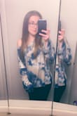 So soft and so cute! It definitely runs large and I debated buying a smaller size. I decided to keep it and I just always wear it off one shoulder. It worked out because it's so cute that way. I thought it was a little weird how the sleeves were made with two pieces, but it's not a big deal. Just makes them more open and flowy. I love it so much I've considered buying it in the other color too! - Jessica M.