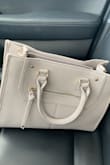 This purse has pockets for my phone and is big enough where it fits everything I need. Love this purse and would 1,000% recommend. - Brooke I.