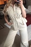 It's so cute!!! Fits pretty decently and you can adjust the waist. The bottom is quite flared. - Marina P.