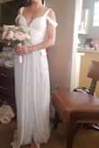 According to size guide, I should be a M so it's amazing that I fit in this XS. It's snug but perfect. Makes my chest look great. Lightweight, romantic and perfect for my beach wedding. - Stephanie W.