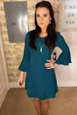 If I had been looking for a dress to wear to work, I would give it 5 stars! However, I purchased it to consider for a formal, Catholic wedding I'm attending and it didn't quite do enough for me for it to make the cut. I like how classy it is, I just would need it to be a bit shorter (more like how it appears on the model) for me to be excited about it. I'm petite, so I expected it to be longer on me, just hoped it would still look flirty. Love the color! Definitely looks better when dressed up with a long necklace. - Catherine G.