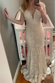I love this dress and will wear it for my wedding. Small fits nicely through my hips with room to move/dance but it will need to be taken in at the waist, bust, and shoulders. It is long, too, but I am short. (I have heels on in one of the photos.) The dress feels like great quality and doesn't show any mama tummy. - Meghan W.