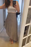 This skirt is so beautiful, flowy and fits perfectly at my natural waist, my problem is that the asymmetrical hem is really just too short. If the wind blows even slightly people would be getting a great view of my left butt cheek. So I'm really sad. I haven't decided yet if I'm going to return it because it's short or keep it because it's beautiful and use it is motivation to keep doing squats... - Victoria L.